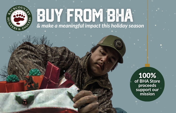 Buy From BHA and make a meaning impact this holiday season! A man pull presents from a bag.